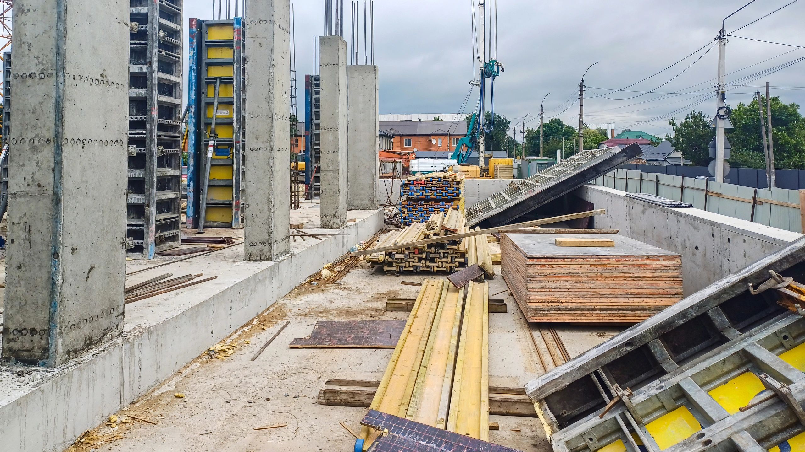 Construction site with concrete foundations and building columns